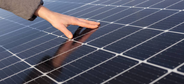 istock Hand touching solerne panels, Space for text, description. BANNER. 1369620275