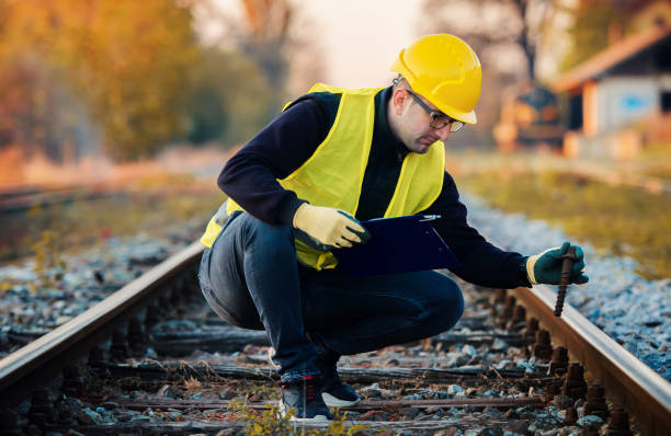istock Railroad inspection. Technician found damage on the railway during the inspection. Transportation concept 1369620388