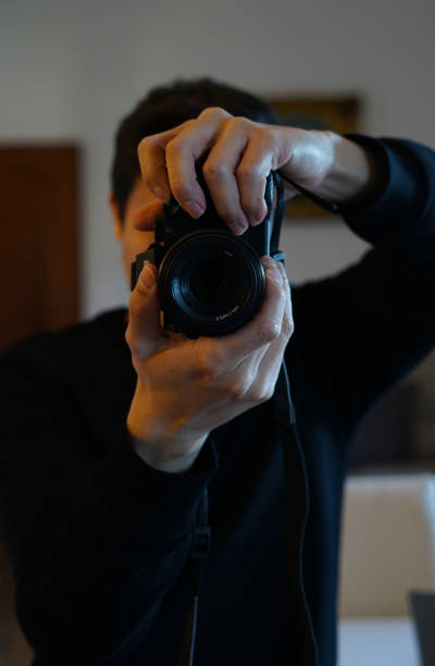 istock Photographer taking picture with professional camera 1369622190