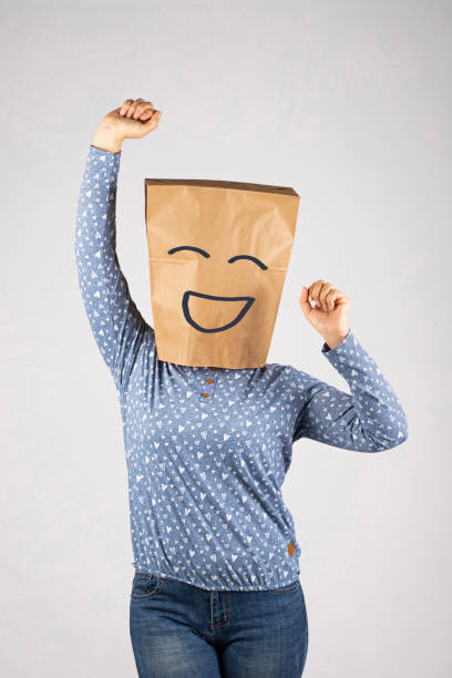istock Woman with paper bag on head 1369623103