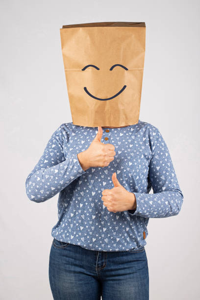 Woman with paper bag on head