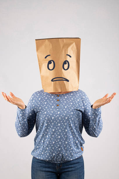 Woman with paper bag on head