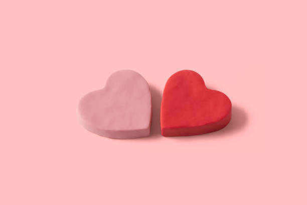 istock Two 3D hearts handmade with red and pink plasticine with copy space 1369624459