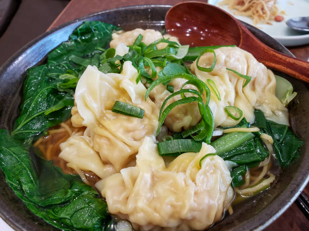 istock Chinese style dumplings (wontons) and egg noodles soup 1369625548