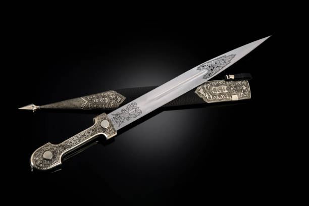 istock collectible silver dagger with scabbard on black 1369628432