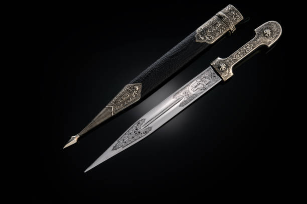 istock collectible silver dagger with scabbard on black 1369628461