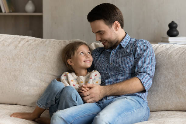 istock Loving young father talking with little kid daughter. 1369630271