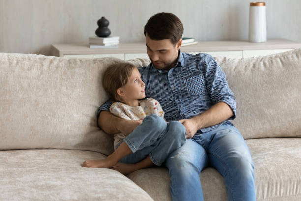 istock Affectionate millennial single father talking with kid daughter. 1369630278