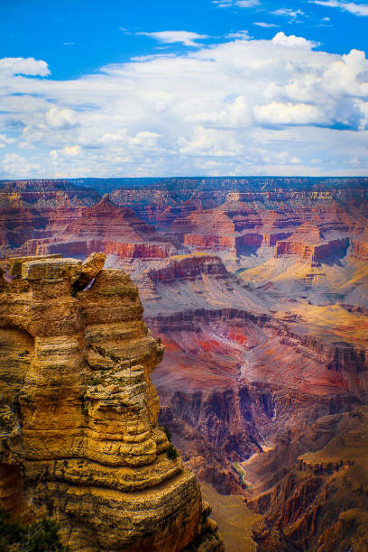 The Grand Canyon - Magnificent vertical view of Colorado River running through the depths with late afternoon sun highlighting the cliffs The Grand Canyon - Magnificent vertical view of Colorado River running through the depths with late afternoon sun highlighting the cliffs south rim stock pictures, royalty-free photos & images