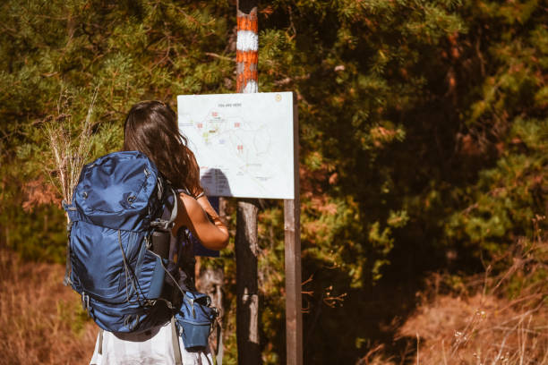 istock Young backpacker going hiking and walking through a sandstone valley 1369631782