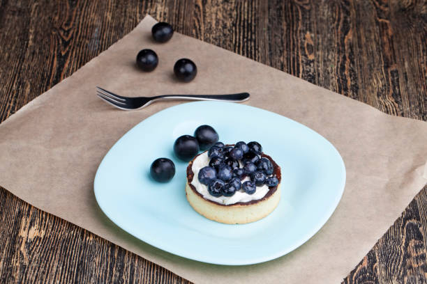 istock tartlet with chocolate and buttercream with blueberries 1369632733