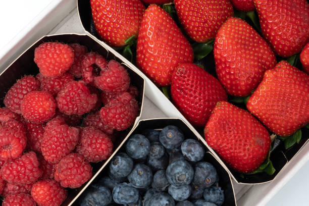 istock trays with berries, fresh strawberries, ripe blueberries and raspberries 1369635568