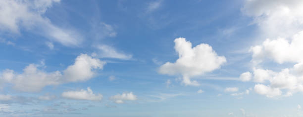 istock Panorama of blue sky with white clouds in clear weather 1369635890