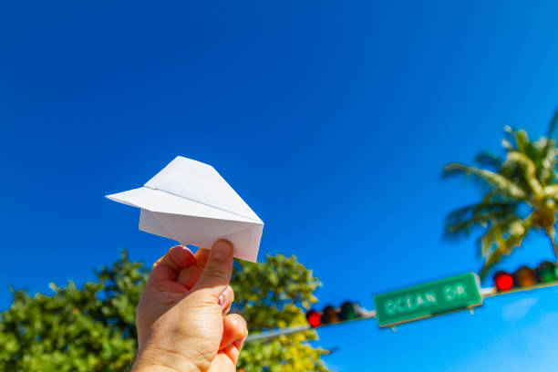 POV Point of view shot of a young travel male enjoying his vacations while playing with a paper airplane in front of Ocean Drive, South Beach, Miami Beach, Miami, South Florida, United States of America. Travel Concept. POV Point of view shot of a young travel male enjoying his vacations while playing with a paper airplane in front of Ocean Drive, South Beach, Miami Beach, Miami, South Florida, United States of America
The picture is in the famous and touristic Art Deco District. Shooting from a personal perspective in an exotic tropical beach travel holidays.
Travel Concept. 1 hotel south beach stock pictures, royalty-free photos & images