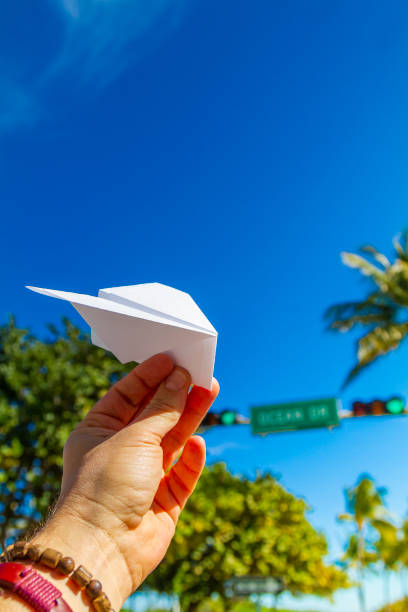 POV Point of view shot of a young travel male enjoying his vacations while playing with a paper airplane in front of Ocean Drive, South Beach, Miami Beach, Miami, South Florida, United States of America. Travel Concept. POV Point of view shot of a young travel male enjoying his vacations while playing with a paper airplane in front of Ocean Drive, South Beach, Miami Beach, Miami, South Florida, United States of America
The picture is in the famous and touristic Art Deco District. Shooting from a personal perspective in an exotic tropical beach travel holidays.
Travel Concept. 1 hotel south beach stock pictures, royalty-free photos & images