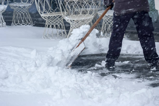 istock a man cleans the snow with a shovel 1369639797