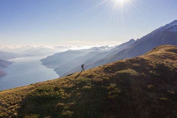istock Aerial view, man hiker reaches the top 1369640531