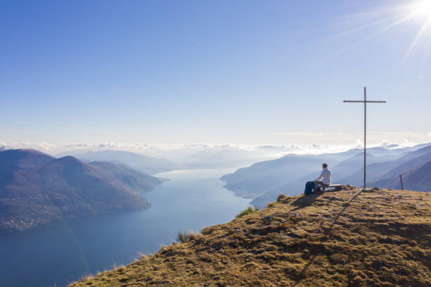istock Hiker male relaxes at mountain top 1369640533
