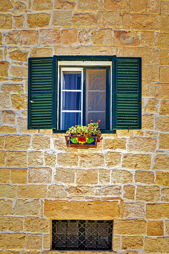 A Quaint Little Louvered Window in Mdina in Mdina, Malta