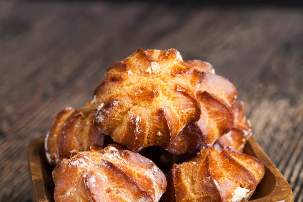 istock delicious choux pastry with powdered sugar 1369643844