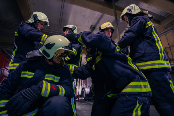 istock Portrait of group of firefighters wearing protective uniform inside the fire station 1369644921