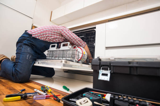 istock Handyman repair dishwasher in  the kitchen 1369645377
