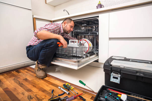 istock Handyman repair dishwasher in  the kitchen 1369645378