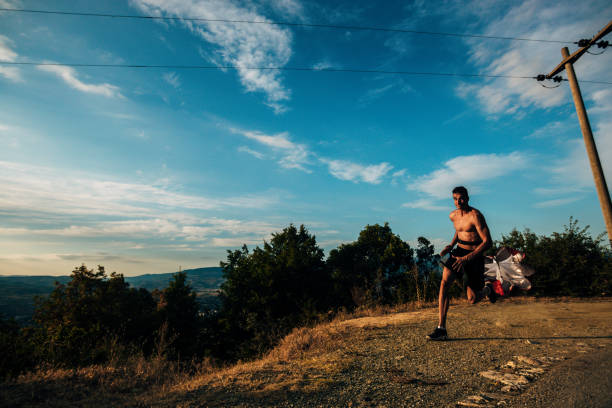 istock Silhouette man working out with parachute 1369646338