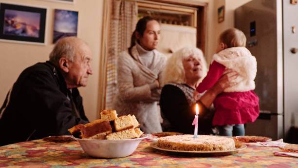 istock First birthday celebration with the family during COVID-19. 1369651481