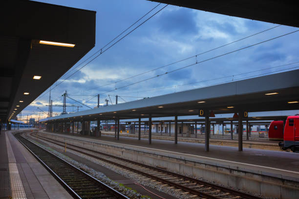 istock Platform, rails and locomotives on a train station 1369652499