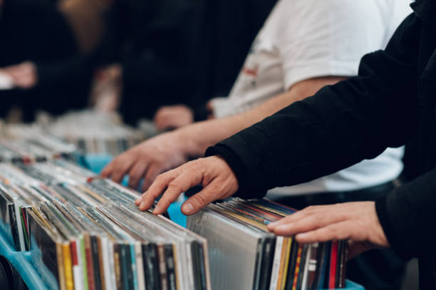 istock Man hands browsing vinyl album in a record store 1369652705