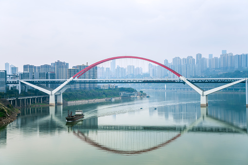 Modern buildings and overpasses in Chongqing riverside city on cloudy days