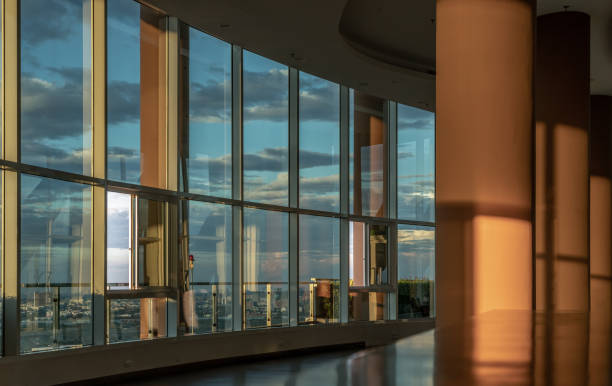 Bangkok, Thailand - 02 Feb, 2022 : Common area of Residence building at evening time. New normal, The seats were set separately according to social distancing policy for the spread of covid-19 prevention, Selective focus.