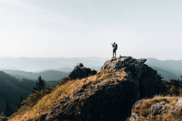 Backpacker takes photo from a mountain summit Above the Black Forest,  Baden-Württemberg baden württemberg stock pictures, royalty-free photos & images