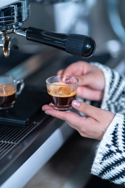 istock Preparing an express coffee in a professional coffee machine. 1369660870