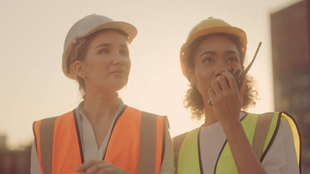 istock Two female shipping working and checking container in the port 1369665630