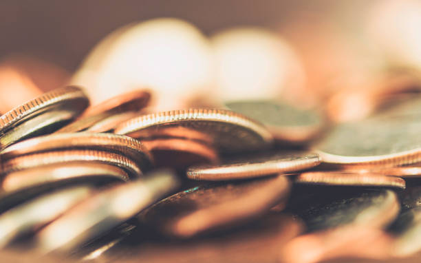Background of defouced generic coins. Loose change and savings concept