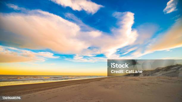 Big Sky Over Sandy Beach And Ocean In North Carolina Outer Banks At Sunrise Stock Photo - Download Image Now