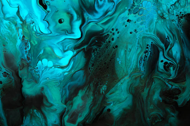 istock Fluid Art. Green and blue abstract wave swirls on black background. Marble effect background or texture 1369677222