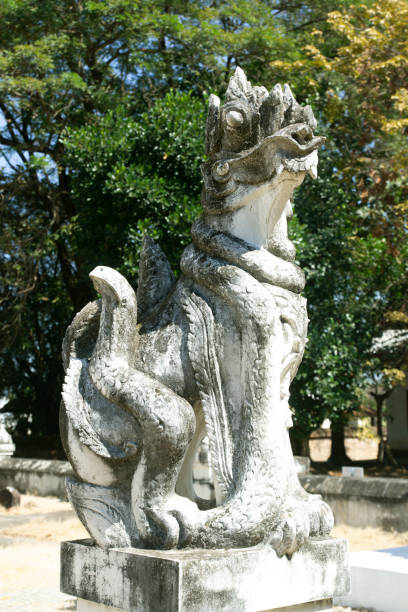 istock Ancient lion statue in Wat Phra Yuen, Lamphun, Thailand 1369681596