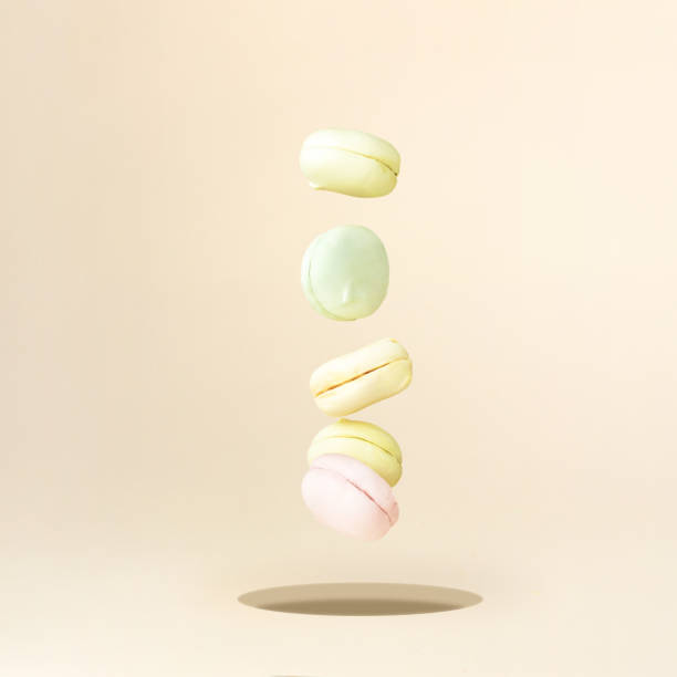 Macaron marshmallow Dessert falling down. Colorful Macaroons Flying. Gourmet Colored Macaroon Cookies