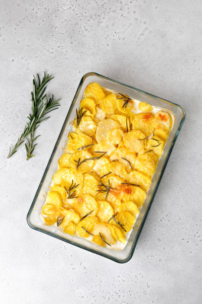 istock Baked potato with cream, cheese and garlic. Potato casserole. Step-by-step recipe. 1369688004