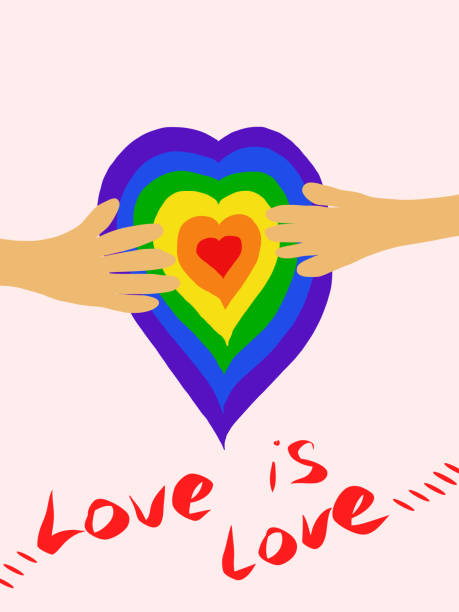 istock LGBT on heart shaped paper, LGBT pride heart and rainbow isolated on white background includes a pair of hands on a LGBT heart. 1369688604