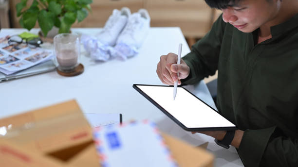 istock Small business owner using digital tablet receive order from customer. 1369691553