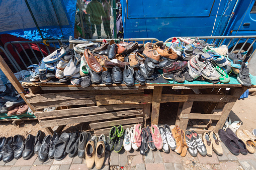 Colombo, Sri Lanka - February 5, 2020: Old shoes are sold at the street market in Colombo