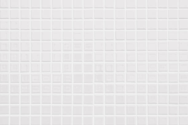istock White or gray ceramic wall and floor tiles abstract background. Design geometric mosaic texture decoration of the bedroom. Simple seamless pattern for backdrop hospital wall, canteen and grid paper. 1369696807