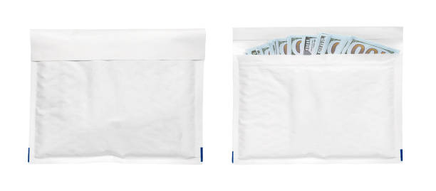 istock Money dollars in paper envelope on a white background 1369697764