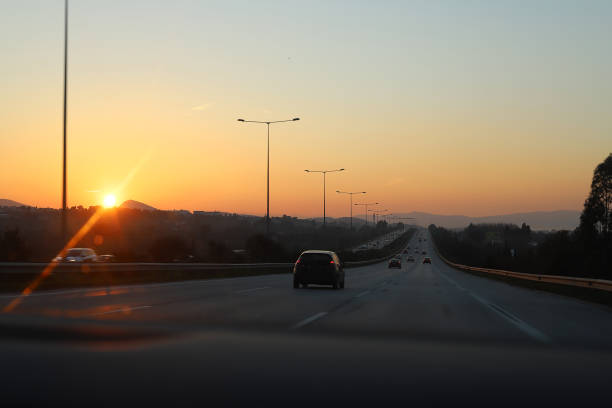 istock The sunset view of a road while returning home from work 1369697964
