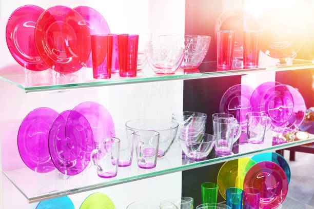 Glass colored dishware plates and mugs on shop