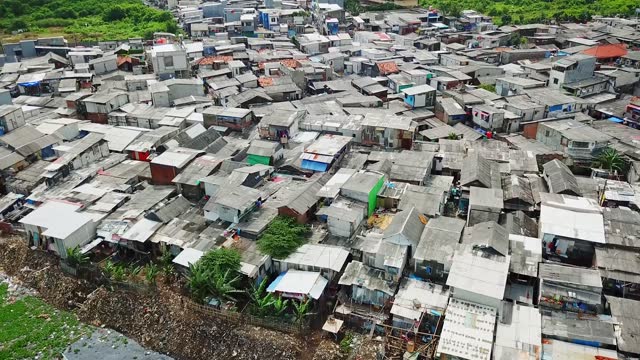 Aerial landscape of slum houses on lakeside